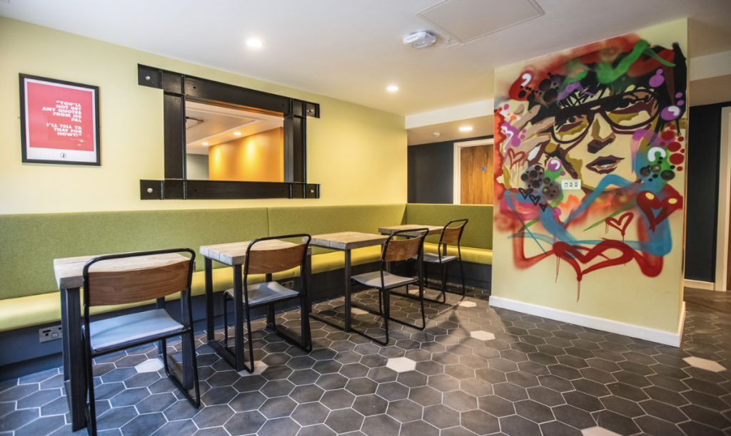 Communal sitting/dining area at Jonas long-stay hotel in Sheffield