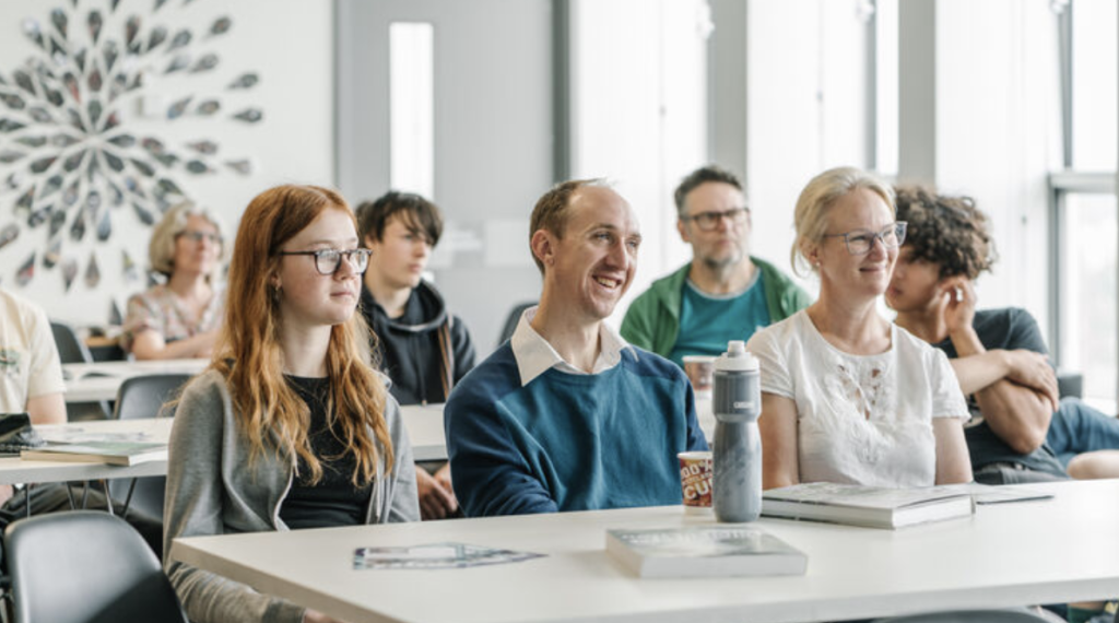 Prospective students and their parents during a subject talk at a Sheffield University open day