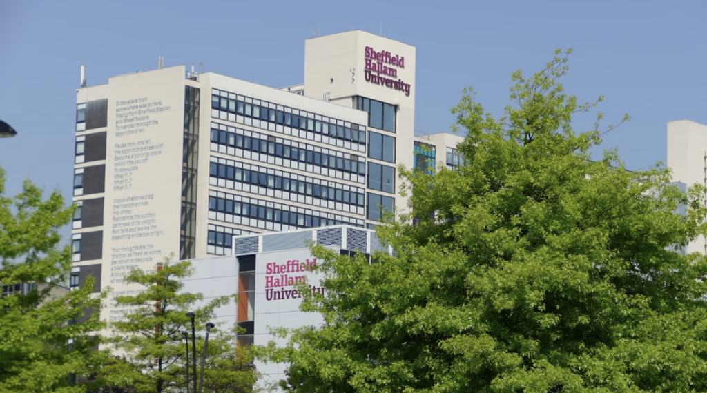 Sheffield Hallam university building exterior with trees in the foreground