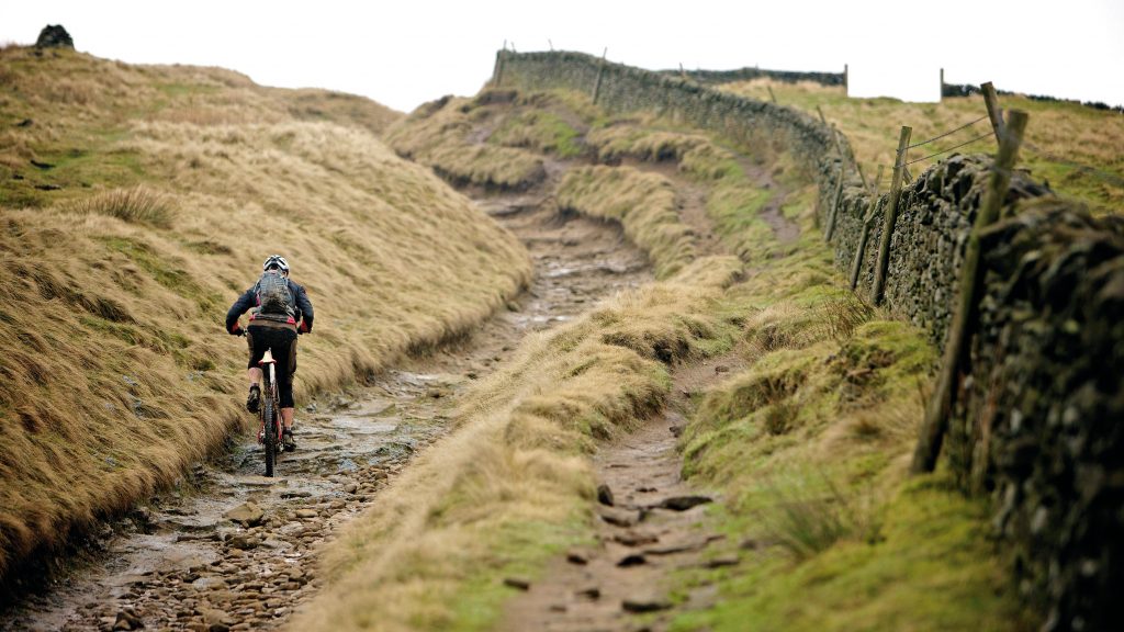 Man cycling through the nearby Peak District, Sheffield